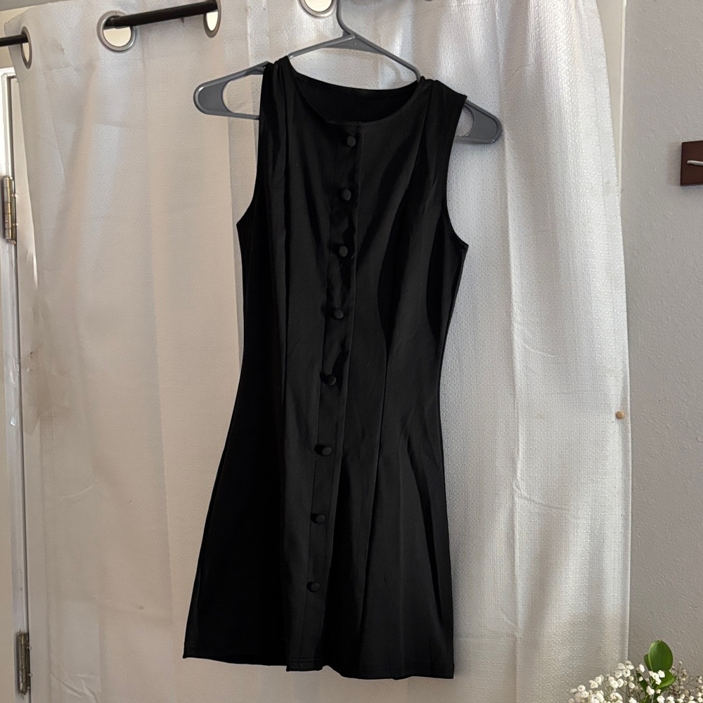 Black Sleeveless Dress
Never worn